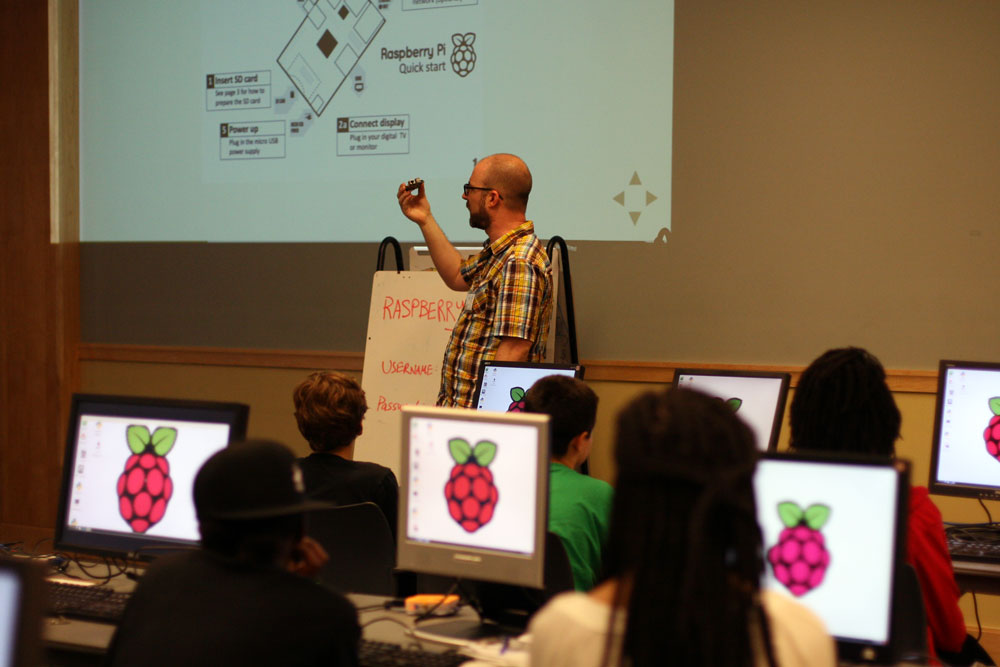 2013 Teen Tech Camp lead instructor Clinton Dreisbach explaining the workings of a Raspberry Pi