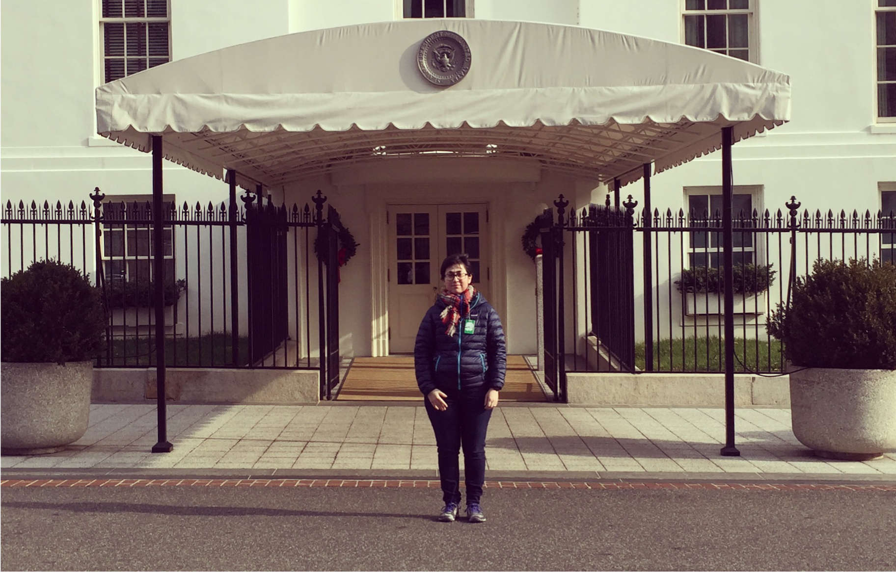 Julia Elman in front of the entrance to the West Wing, The White House